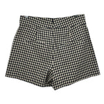 Black-and-white check tailored shorts with belt loops and pleated front