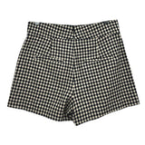 Black-and-white check tailored shorts with belt loops and pleated front
