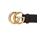 Black leather belt with gold GG buckle and strap keeper