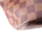 Louis Vuitton Damier Ebene tote bottom corner close-up with stitched rounded leather edge