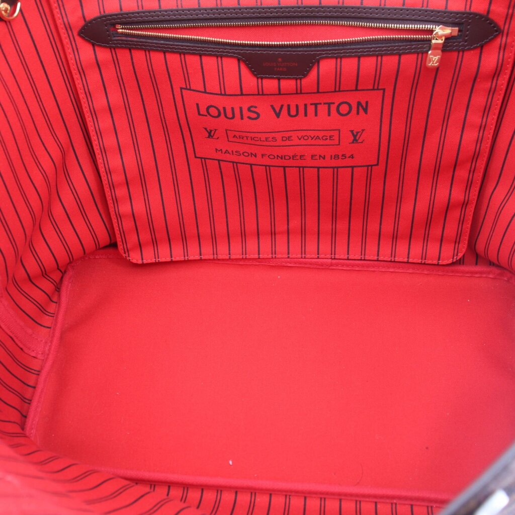 Louis Vuitton Neverfull GM tote interior label on red lining with zip pocket