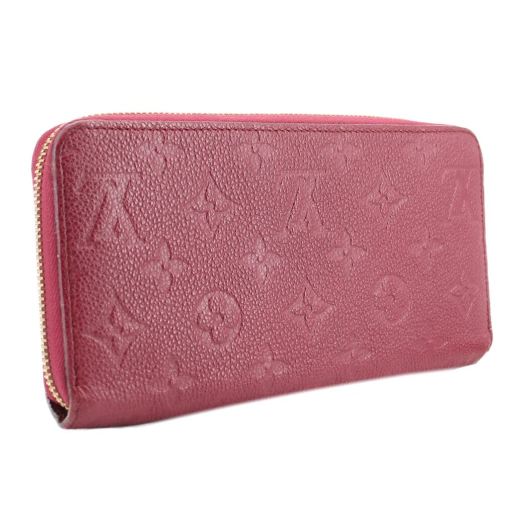 Empriente zip wallet side view in burgundy leather with gold-tone zipper pull.