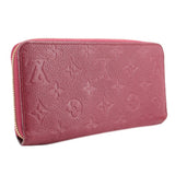 Empriente zip wallet side view in burgundy leather with gold-tone zipper pull.