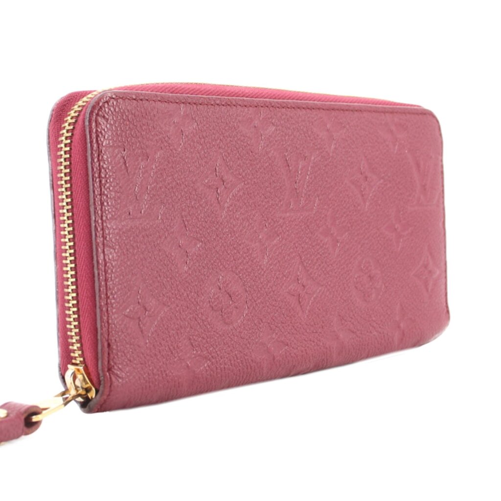 Empriente zip wallet with gold-tone zipper along side seam in burgundy leather.