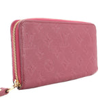 Empriente zip wallet with gold-tone zipper along side seam in burgundy leather.