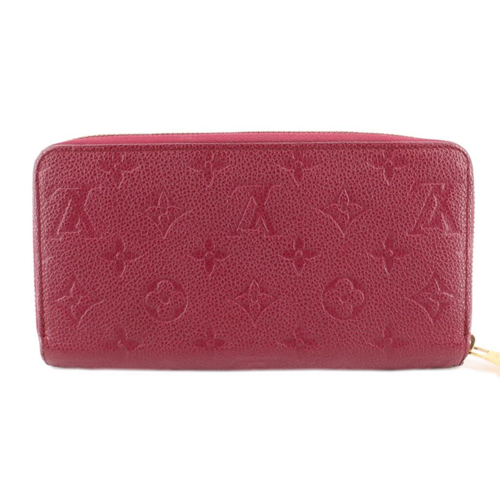 Empriente zip wallet back view in burgundy leather with embossed monogram pattern.