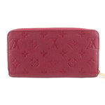 Empriente zip wallet back view in burgundy leather with embossed monogram pattern.