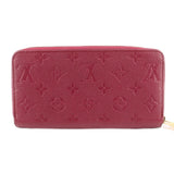 Empriente zip wallet back view in burgundy leather with embossed monogram pattern.