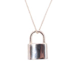 Close-up sterling silver padlock necklace pendant with arched top and reflective lock