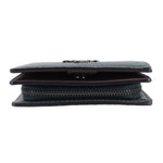 Green pebbled leather snap wallet, close side view of folded layers