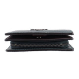 Green pebbled leather snap wallet, close side view of folded layers