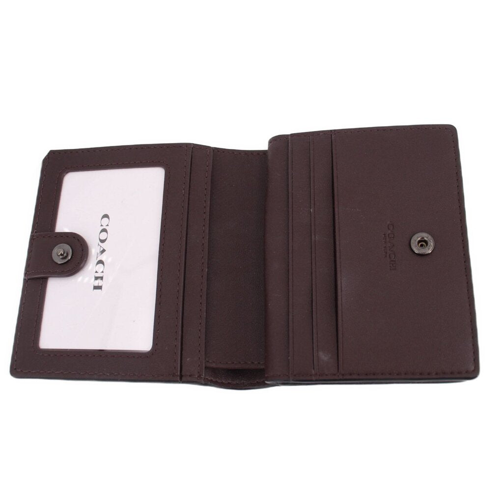 Snap wallet interior with card slots and COACH-branded ID window