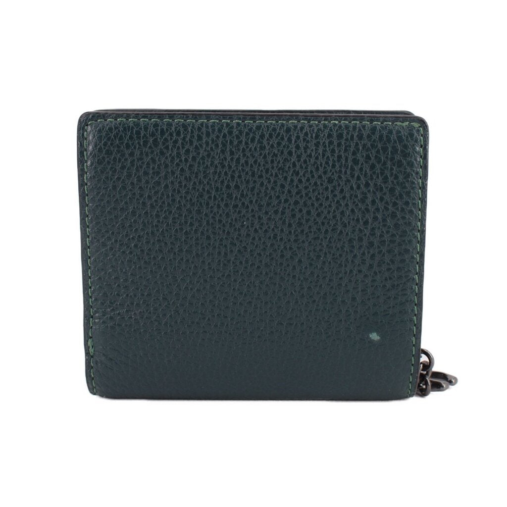Green pebbled leather snap wallet with COACH logo, front view