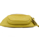 Chartreuse belt bag top profile with padded flap and side zipper pull