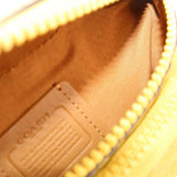COACH embossed patch on warm brown lining with stitched edge