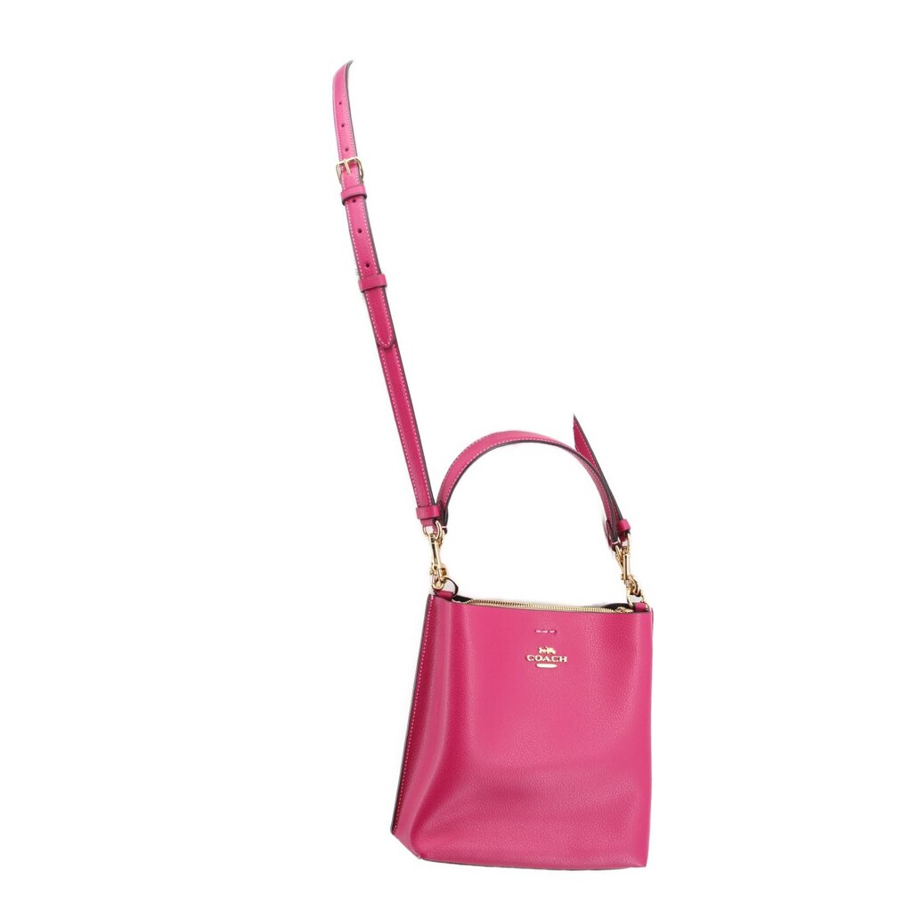 Coach Mollie bucket crossbody bag, fuchsia body with long strap and top handle.