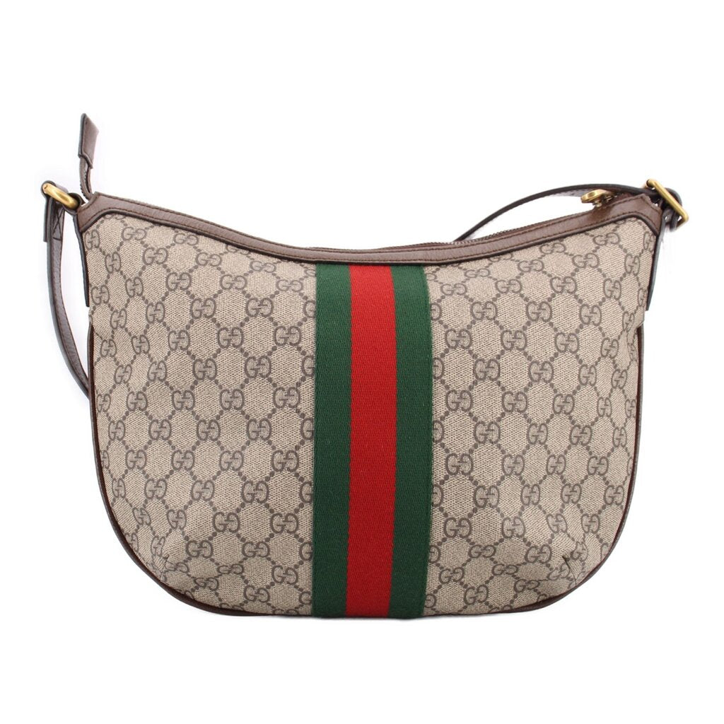 Brown GG canvas crossbody bag with centered green-red web stripe and gold GG clasp