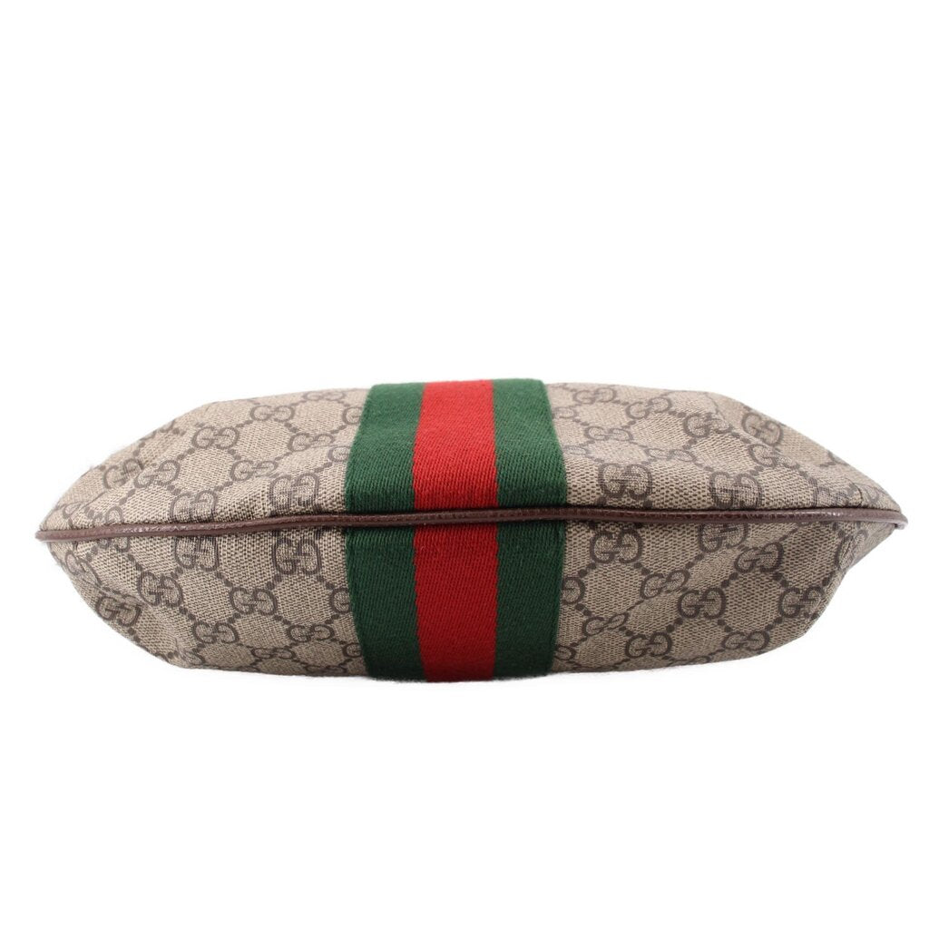 Brown GG canvas bag end view with green-red web stripe across the front panel