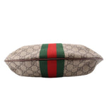Brown GG canvas bag end view with green-red web stripe across the front panel