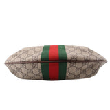 Brown GG canvas bag end view with green-red web stripe across the front panel