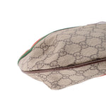 Brown GG canvas bag corner detail with green-red web stripe and brown edge trim