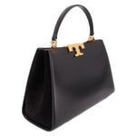 Black Tory Burch Eleanor satchel angled view with gold logo clasp and handle