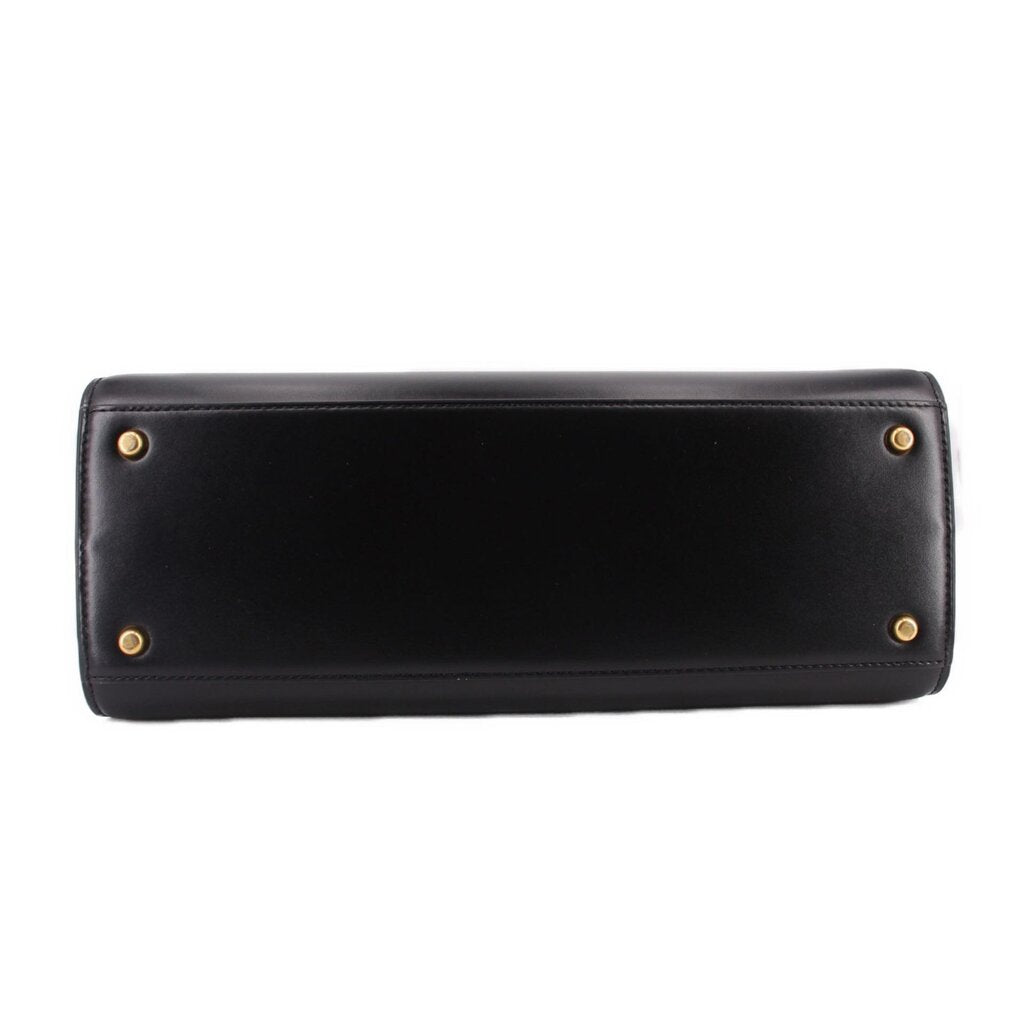 Black Tory Burch Eleanor satchel front panel with gold button hardware