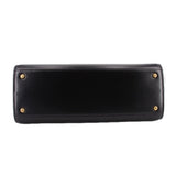 Black Tory Burch Eleanor satchel front panel with gold button hardware