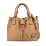 Tan leather drawstring satchel bag with double handles and logo charm