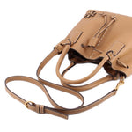 Tan leather drawstring satchel with shoulder strap and front logo detail