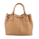 Tan leather drawstring satchel bag with front pocket panel and top handles