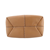 Tan leather drawstring satchel with foldover top and central vertical stitching