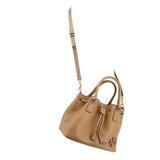 Tan leather satchel with long adjustable strap and drawstring closure