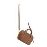 Brown woven satchel with long shoulder strap and side zipper pocket, angled view.