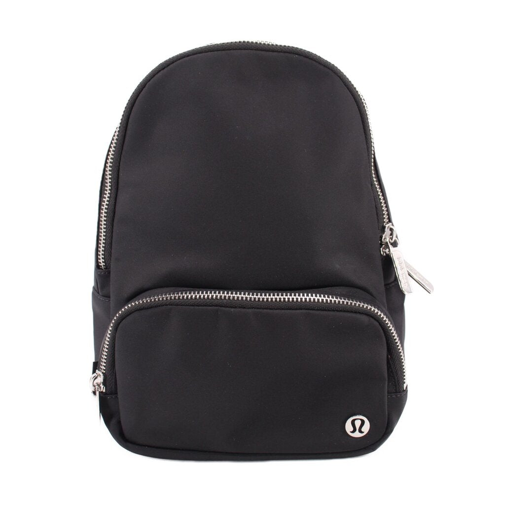 Black sling bag with rounded top and front zipper pocket