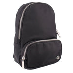 Black mini sling backpack with front zip pocket and silver-tone zipper pulls