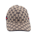 Beige GG monogram baseball cap with navy bill and red-blue web stripe on side
