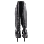 Knee-high leather boots showing back seams and stiletto heel, black