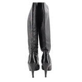 Knee-high leather boots showing back seams and stiletto heel, black