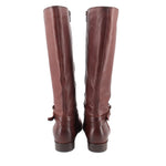 Brown leather knee-high boots viewed from back with zip and heel