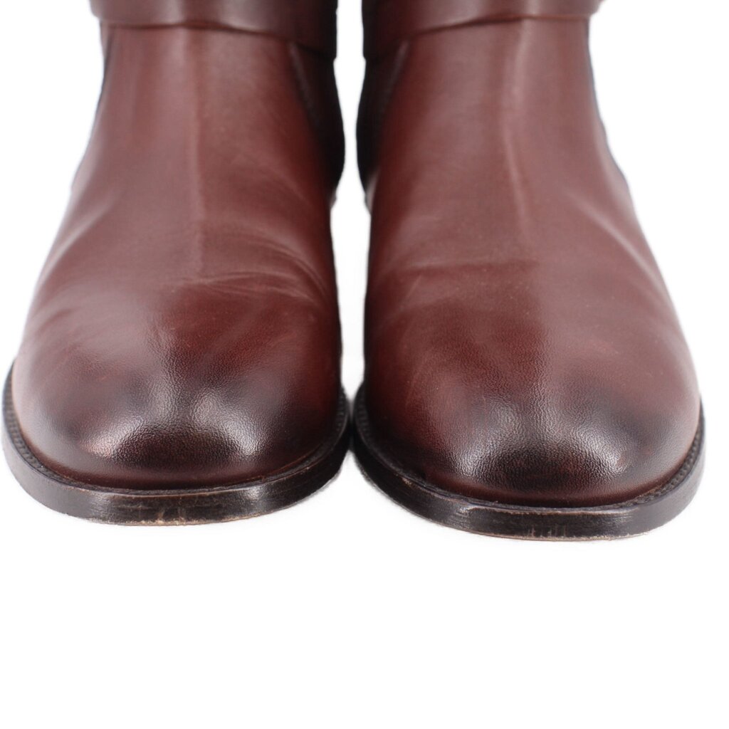 Close-up of brown leather boot toes and heels