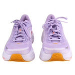Pair of purple running sneakers, orange heel panels, lavender laces