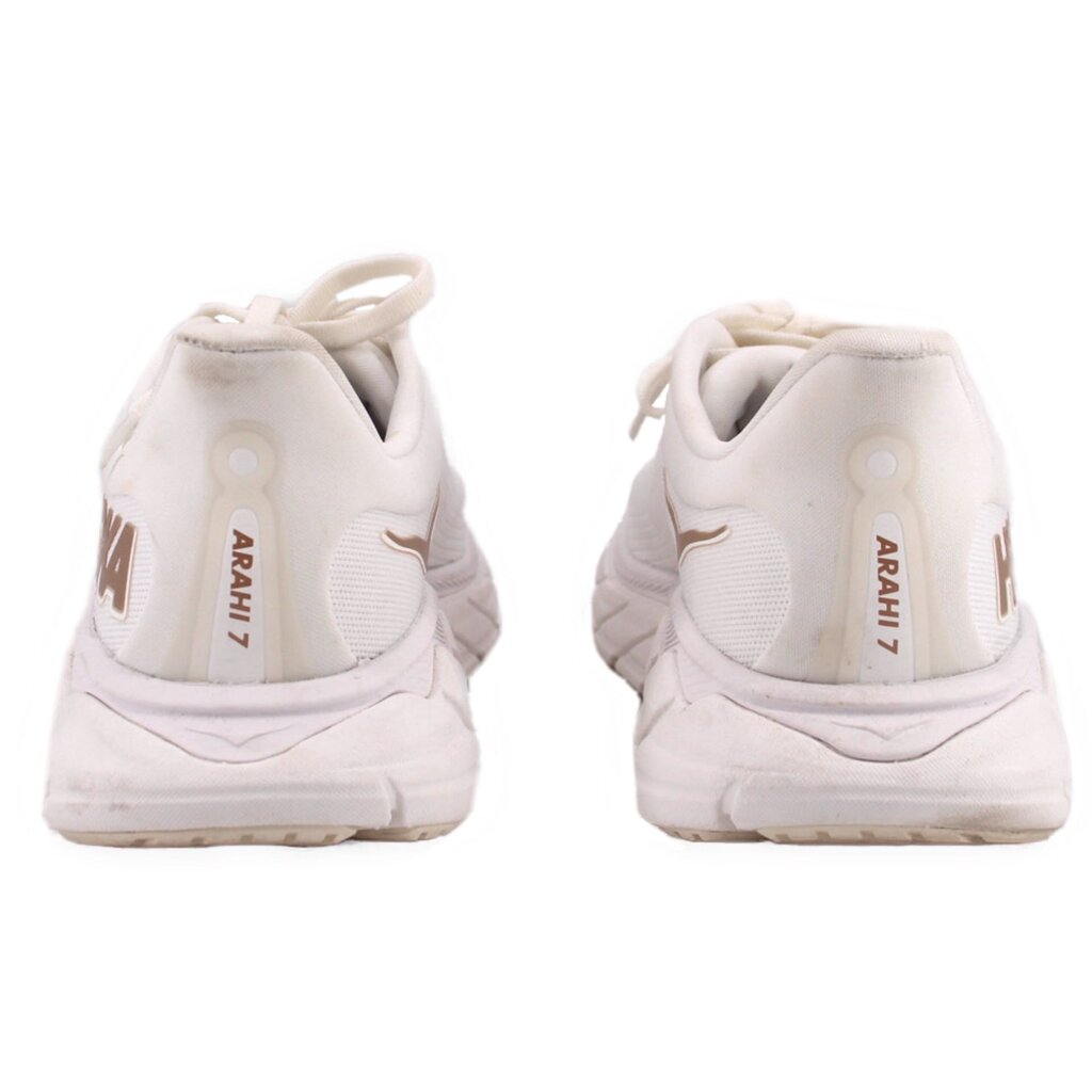 White sneakers with HOKA and ARAHI branding on heel, padded collar, lace-up