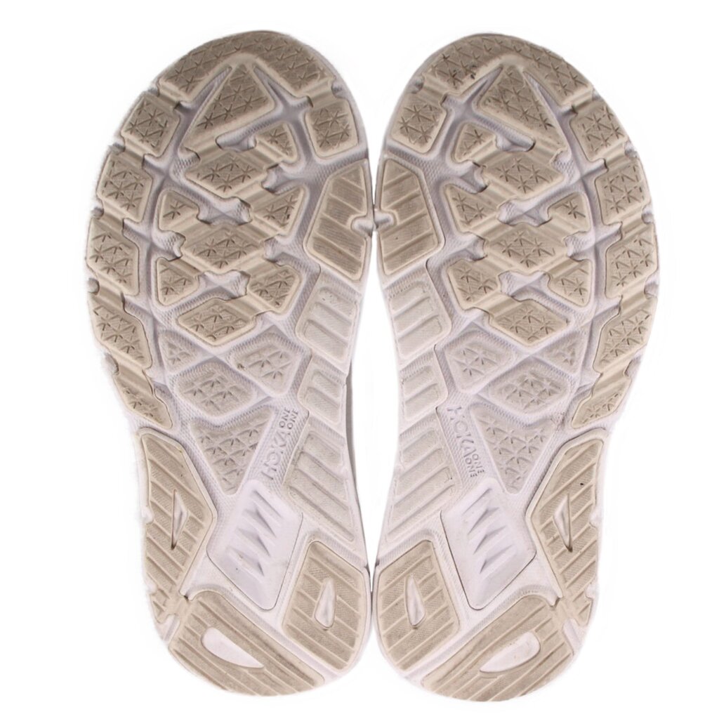 White rubber outsole with molded tread pattern for traction