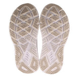 White rubber outsole with molded tread pattern for traction