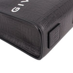 Black embossed leather tote corner with square patch and stitched edge