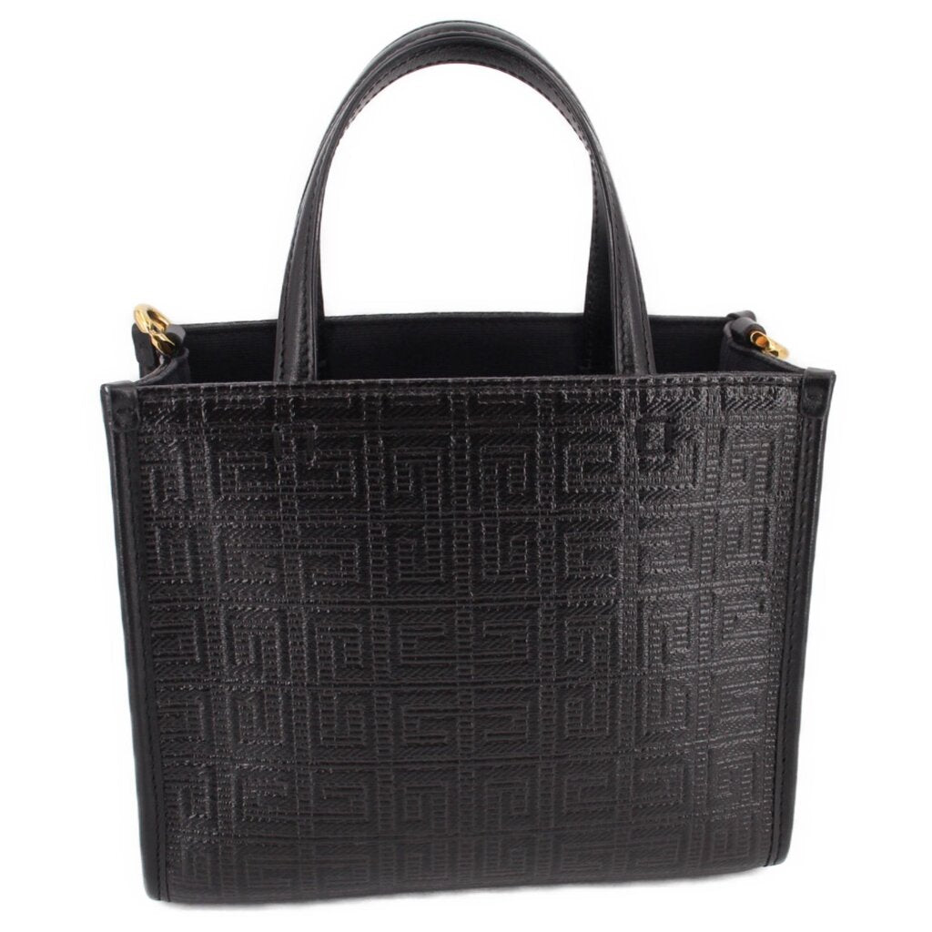 Black mini G tote crossbody with embossed monogram pattern and top handles