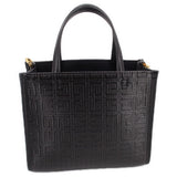 Black mini G tote crossbody with embossed monogram pattern and top handles
