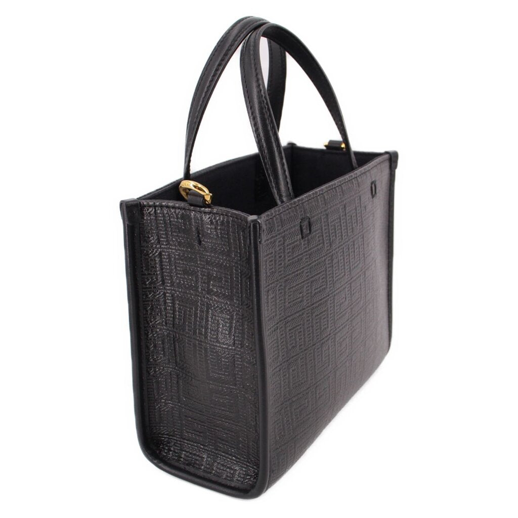 Black mini G tote crossbody with shoulder strap, gold hardware, and structured shape