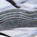 Inside view of gray camo mini bag with stitched lining and black trim